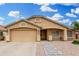 Charming single-story home featuring a two-car garage and neutral-toned exterior with well-maintained landscaping at 2300 E Austin Dr, Gilbert, AZ 85296