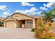 Well-maintained single-story home featuring a two-car garage, neutral exterior, and desert landscaping at 2300 E Austin Dr, Gilbert, AZ 85296