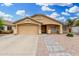 Charming single-story home featuring a two-car garage and neutral-toned exterior with well-maintained landscaping at 2300 E Austin Dr, Gilbert, AZ 85296