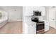 Modern kitchen features white cabinets, stainless steel appliances, and stylish countertops at 2300 E Austin Dr, Gilbert, AZ 85296