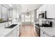 Bright kitchen with stainless steel appliances, white cabinets, and an eat-in breakfast nook at 2300 E Austin Dr, Gilbert, AZ 85296
