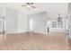 Open-concept living area with tile floors, vaulted ceilings, and seamless transition to the kitchen at 2300 E Austin Dr, Gilbert, AZ 85296