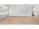 Spacious living room featuring tile flooring, white walls, and large windows for natural light at 2300 E Austin Dr, Gilbert, AZ 85296