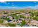Desert neighborhood with tree lined streets and homes with solar panels and pools at 24916 N 80Th Ln, Peoria, AZ 85383