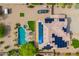 Backyard oasis featuring a large private pool, spa, outdoor lounge area, and solar panels at 24916 N 80Th Ln, Peoria, AZ 85383