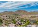 Beautiful view of a neighborhood nestled near mountains, showcasing the desert landscape at 24916 N 80Th Ln, Peoria, AZ 85383