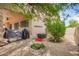 Private backyard with a patio, lush landscaping, and room for outdoor activities at 24916 N 80Th Ln, Peoria, AZ 85383
