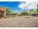 Expansive backyard featuring gravel landscaping and patio area at 24916 N 80Th Ln, Peoria, AZ 85383
