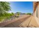 Relaxing balcony view overlooking lush greenery, neighborhood rooftops, and distant mountain at 24916 N 80Th Ln, Peoria, AZ 85383