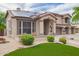 Lovely two-story home with a three-car garage, covered entry, tile roof, solar panels and desert landscaping at 24916 N 80Th Ln, Peoria, AZ 85383