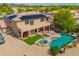 Expansive backyard with a custom pool and spa, covered patio, and lush landscaping at 24916 N 80Th Ln, Peoria, AZ 85383