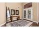 Inviting foyer with decorative rug, wood floors, and stylish decor at 24916 N 80Th Ln, Peoria, AZ 85383