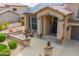 Inviting front entrance with a cozy porch, desert landscaping, and a warm welcome sign at 24916 N 80Th Ln, Peoria, AZ 85383