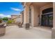Inviting front porch with comfortable seating, attractive columns, and a welcoming entrance to the home at 24916 N 80Th Ln, Peoria, AZ 85383