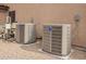 Two American Standard HVAC units sit outside a beige stucco wall at 24916 N 80Th Ln, Peoria, AZ 85383