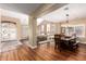 Open-concept living and dining areas featuring hardwood floors and neutral colors at 24916 N 80Th Ln, Peoria, AZ 85383