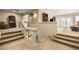 This loft has wall-to-wall neutral carpet with short glass railings at 24916 N 80Th Ln, Peoria, AZ 85383