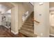 Carpeted staircase with wood railing at 24916 N 80Th Ln, Peoria, AZ 85383