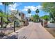 Beautiful two-story house boasting a gated entrance, lush landscaping, and a well-maintained driveway at 2527 E Beechnut Ct, Chandler, AZ 85249