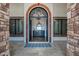 Elegant foyer with stone accents, chandelier lighting, and an attractive decorative cabinet at 2527 E Beechnut Ct, Chandler, AZ 85249