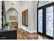 Elegant foyer features ornate doors, hardwood floors, and a stylish console table at 2527 E Beechnut Ct, Chandler, AZ 85249