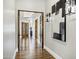 The hallway shows the architectural design of the home with beautiful floors and neutral paint at 2527 E Beechnut Ct, Chandler, AZ 85249