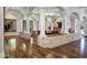 Spacious living area featuring stone accents, hardwood floors, and arched columns at 2527 E Beechnut Ct, Chandler, AZ 85249