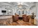 Elegant living room with comfortable seating, hardwood floors, and architectural columns at 2527 E Beechnut Ct, Chandler, AZ 85249