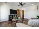 Cozy living room with a ceiling fan, wood floors, wood doors, and comfortable seating at 2527 E Beechnut Ct, Chandler, AZ 85249