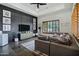 Cozy living room with stylish decor, dark accent wall, and natural light at 2527 E Beechnut Ct, Chandler, AZ 85249