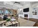 Bright living room with a fireplace, built-in shelving, and a view of the backyard at 2527 E Beechnut Ct, Chandler, AZ 85249