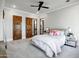 Main bedroom with a ceiling fan, carpet, and wood doors at 2527 E Beechnut Ct, Chandler, AZ 85249