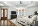 Main bedroom with tray ceiling, chandelier and French doors leading to an outdoor area at 2527 E Beechnut Ct, Chandler, AZ 85249
