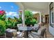 Charming outdoor seating area with stone columns, lush greenery, and a fire pit at 2527 E Beechnut Ct, Chandler, AZ 85249