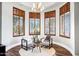 Inviting sitting area with comfortable chairs, plantation shutters, and natural light at 2527 E Beechnut Ct, Chandler, AZ 85249