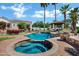 Beautiful backyard with a pool, spa, seating area, and lush landscaping, perfect for relaxation at 2527 E Beechnut Ct, Chandler, AZ 85249