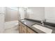 Bathroom features a double sink vanity, a bathtub, and modern fixtures at 26139 S 225Th Way, Queen Creek, AZ 85142