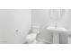 Powder room features a pedestal sink with a round mirror and tile flooring at 26139 S 225Th Way, Queen Creek, AZ 85142