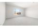 Bedroom featuring neutral walls, gray carpet and a window for natural light at 26139 S 225Th Way, Queen Creek, AZ 85142