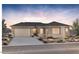 Charming single-story home boasts desert landscaping, a two-car garage, and a neutral-toned exterior at 26139 S 225Th Way, Queen Creek, AZ 85142