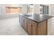 Bright open kitchen features a large island with cabinets, a sink and dishwasher at 26139 S 225Th Way, Queen Creek, AZ 85142