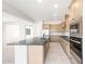 Elegant kitchen featuring stainless steel appliances and a large island with seating at 26139 S 225Th Way, Queen Creek, AZ 85142