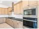 Well-appointed kitchen with stainless appliances, custom cabinetry, and stone backsplash at 26139 S 225Th Way, Queen Creek, AZ 85142