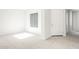 Bright, open-concept living room with a large window and neutral tile flooring at 26139 S 225Th Way, Queen Creek, AZ 85142