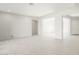 Open living space with neutral paint, tile flooring, and seamless flow to other rooms at 26139 S 225Th Way, Queen Creek, AZ 85142