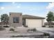 New construction single-story home featuring a two-car garage, desert landscaping, and a modern design at 26682 S 230Th St, Queen Creek, AZ 85142