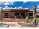 Spacious backyard with patio area, seating, and lush lawn area perfect for relaxation at 2685 N 132Nd Dr, Goodyear, AZ 85395