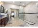 Bathroom featuring a glass shower, modern fixtures, and vanity at 2685 N 132Nd Dr, Goodyear, AZ 85395