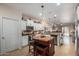 Spacious kitchen showcasing an island, white cabinetry, and stainless steel appliances at 2685 N 132Nd Dr, Goodyear, AZ 85395