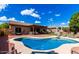 Inviting pool with clear blue water and well maintained patio area and lots of seating at 2685 N 132Nd Dr, Goodyear, AZ 85395